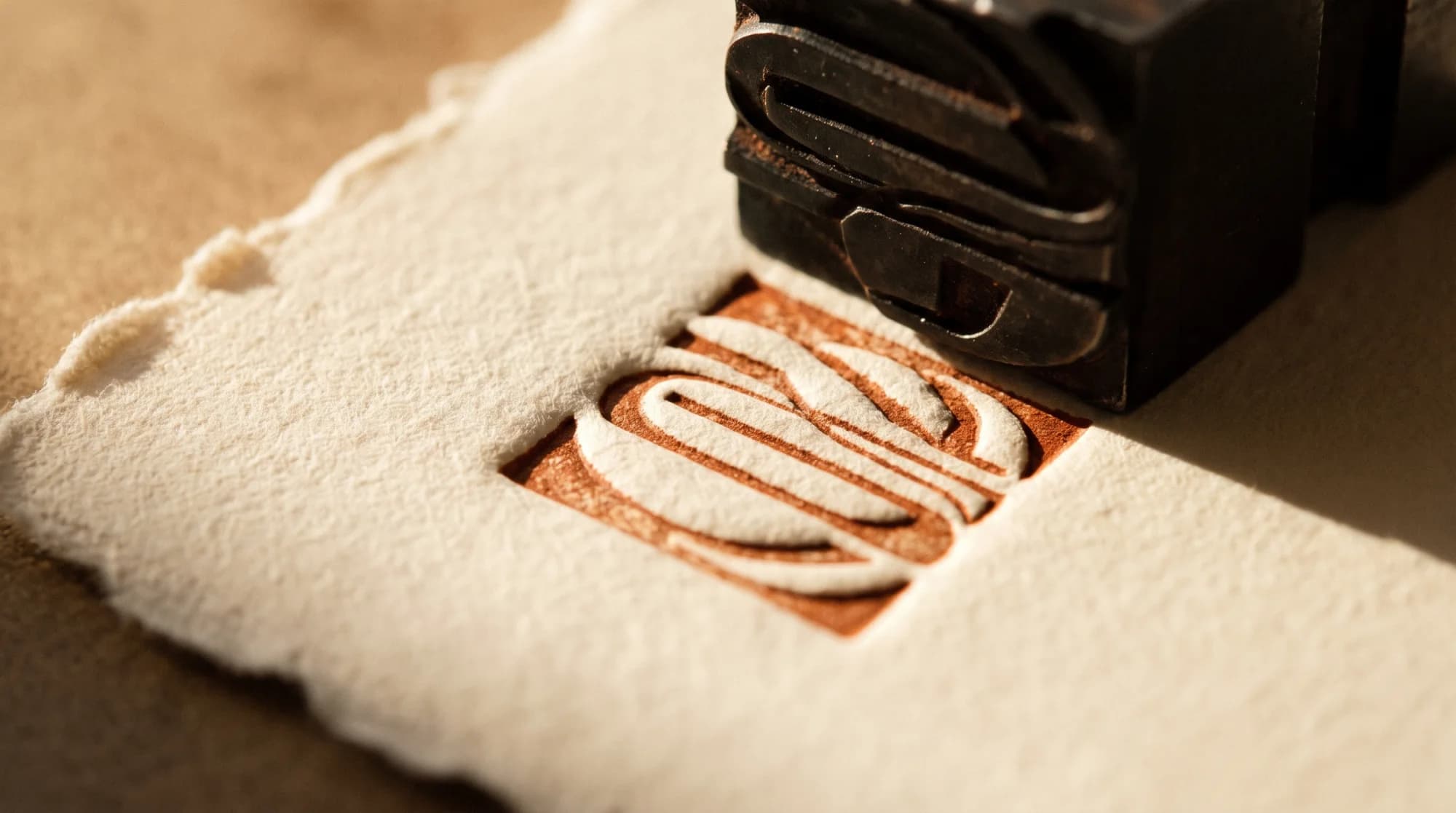 A deep impression pressed into cotton rag paper